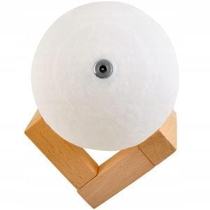 a white ball on a wooden stand