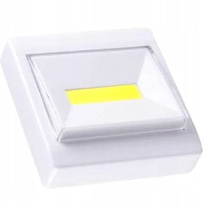 a white square object with a yellow light
