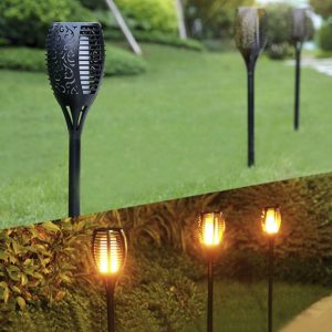 a row of black torches with a lit up light