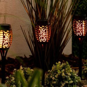 a group of decorative lanterns in a garden