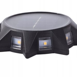 a black circular object with a solar panel