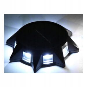 a black circular object with lights