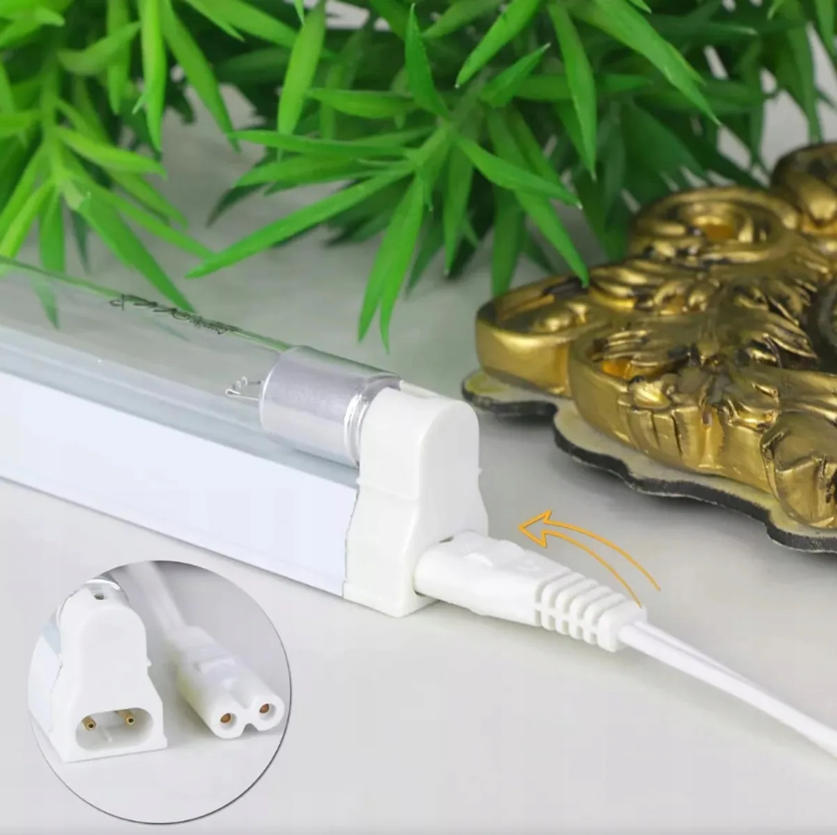 a white light bulb with a wire plugged into it